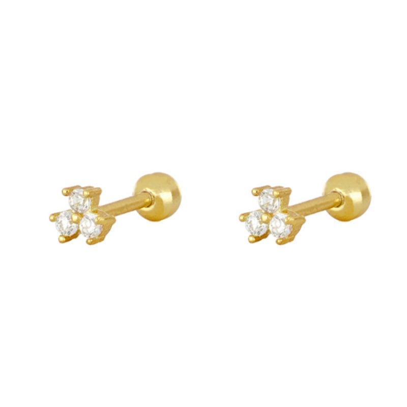Three zirconias piercing gold